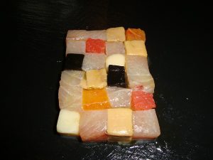 mosaico di ricciola,foie gras,gelatina di seppia e noci macadamia